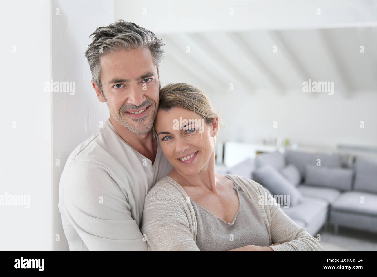 Portrait of mature couple relaxing at home Stock Photo - Alamy