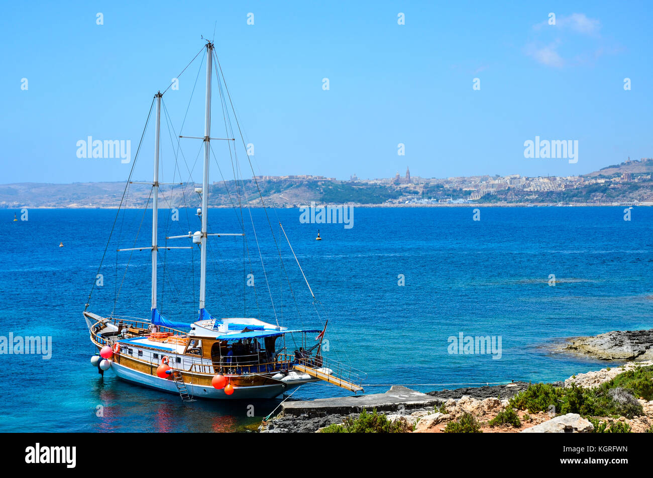 A party boat docked in Comino Island on the Mediterranean Sea, Malta Stock Photo