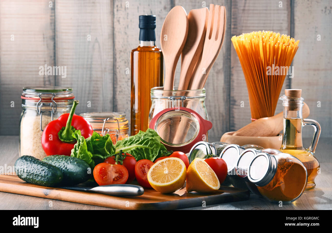 Composition with assorted food products and kitchen utensils on the table Stock Photo