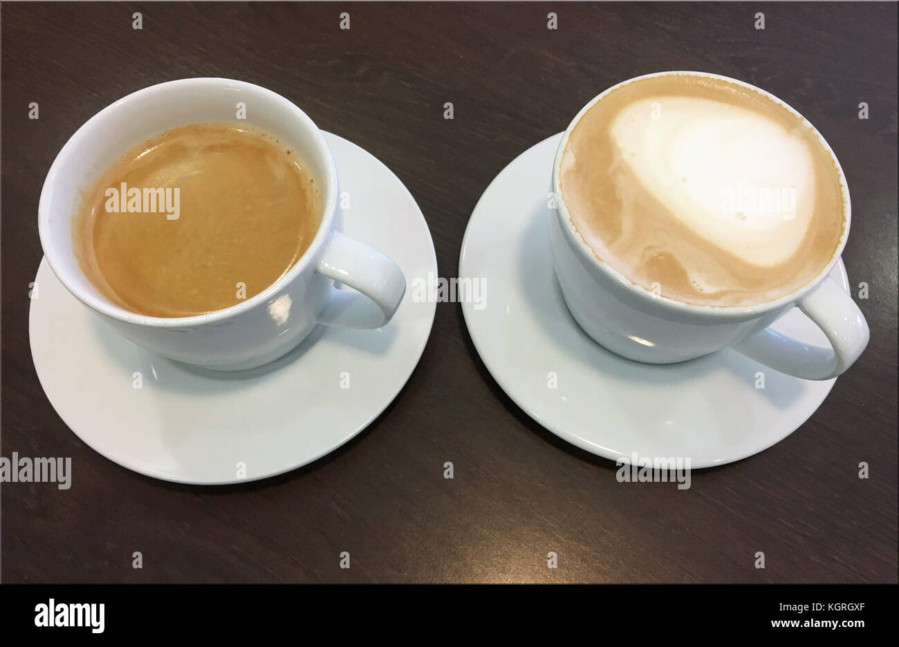 Delicious cups of creamy coffee Stock Photo Alamy