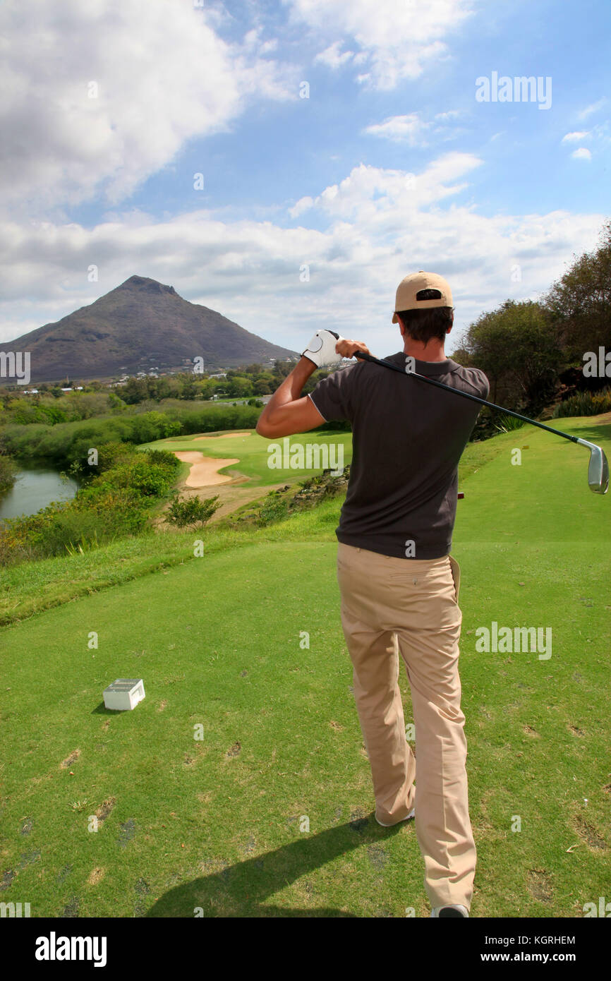 Back view of man playing golf Stock Photo