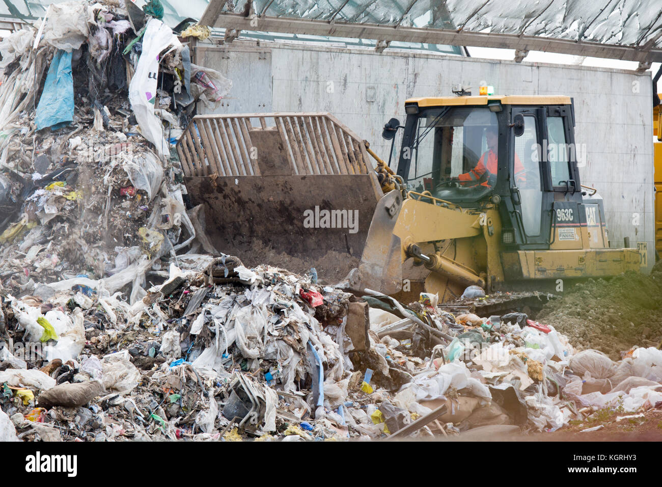 Tractor moving rubbish at Milton Tip near Cambridge Stock Photo Alamy