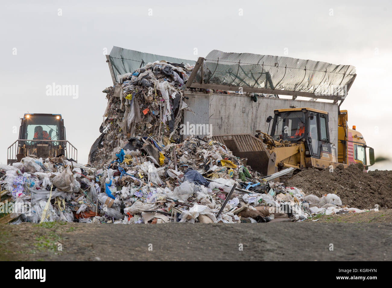Tractor moving rubbish at Milton Tip near Cambridge Stock Photo Alamy