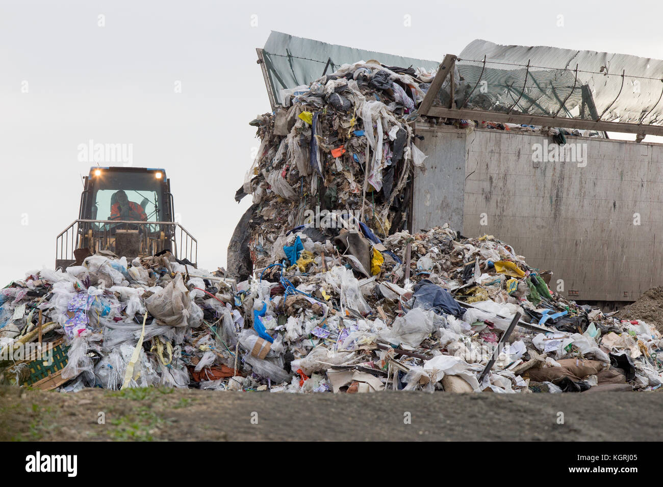 Tractor moving rubbish at Milton Tip near Cambridge Stock Photo Alamy