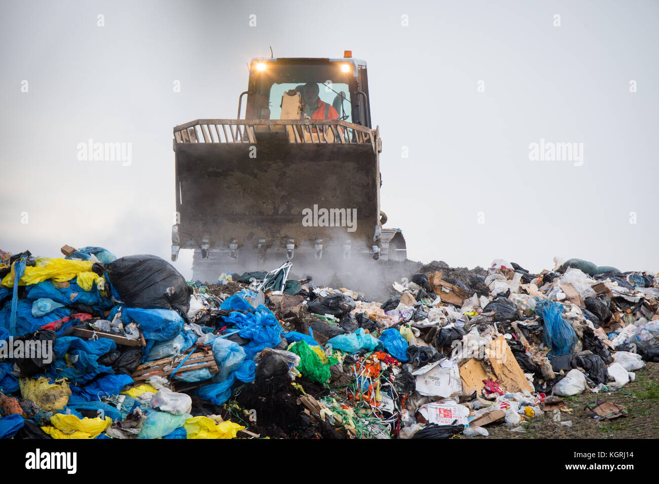 Tractor moving rubbish at Milton Tip near Cambridge Stock Photo Alamy