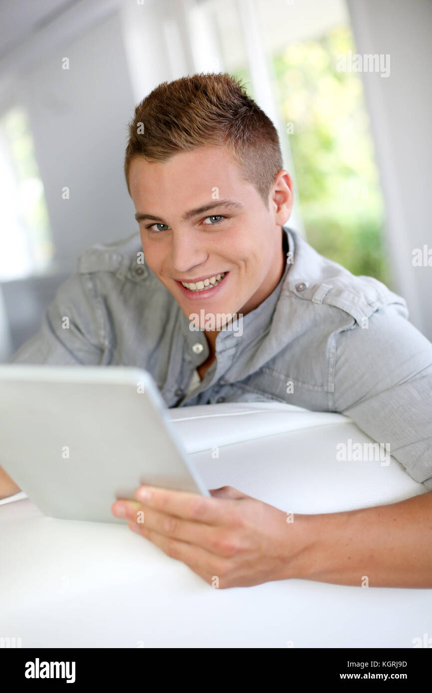 Young Man Using Electronic Tablet At Home Stock Photo Alamy young-man-using-electronic-tablet-at-home-stock-photo-alamy