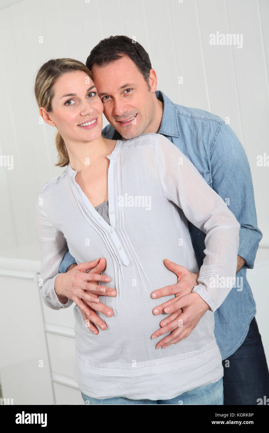 Portrait of man and pregnant woman Stock Photo - Alamy