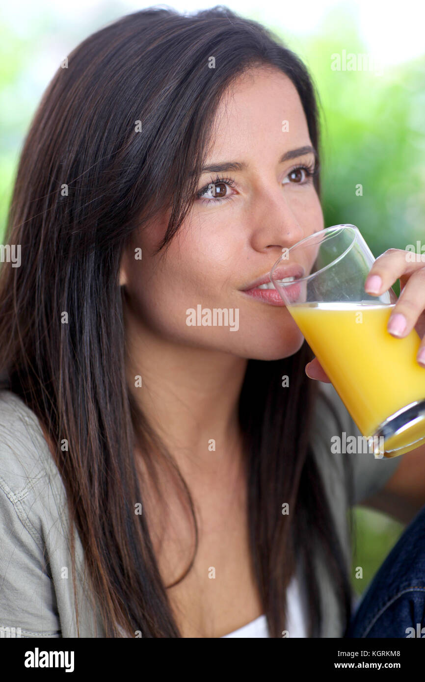 Young woman drinking fresh fruit juice Stock Photo Alamy