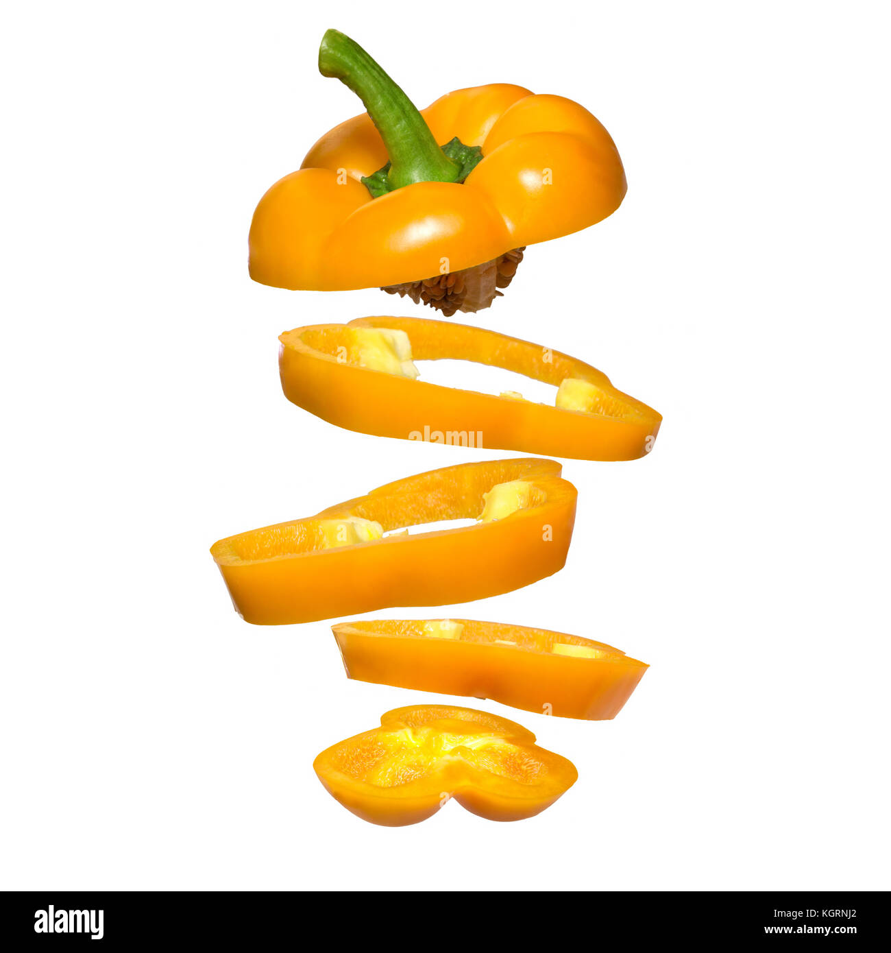 Creative concept with flying yellow paprika. Sliced floating pepper isolated. Levity vegetable. Capsicum Stock Photo