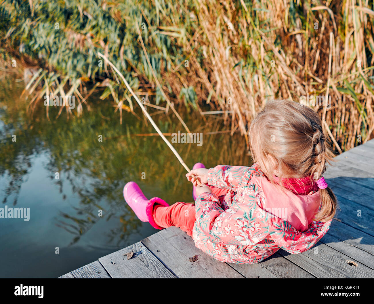 little girl fishing on the river Stock Photo Alamy