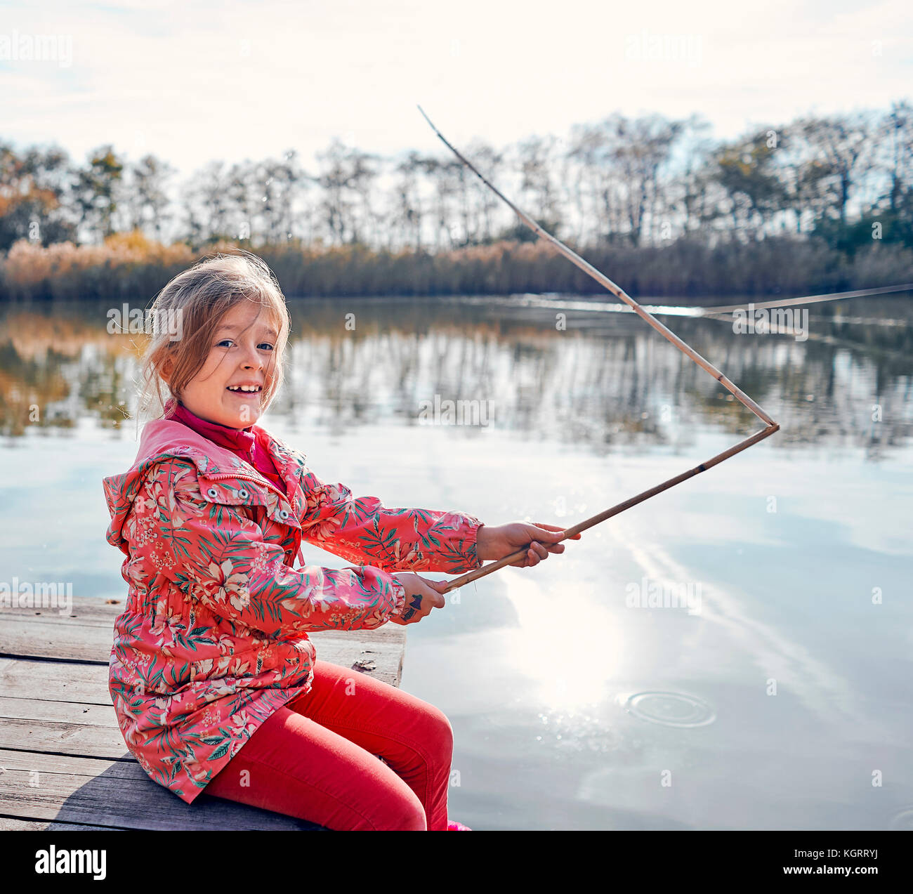 Young girl fish rod fish hi-res stock photography and images