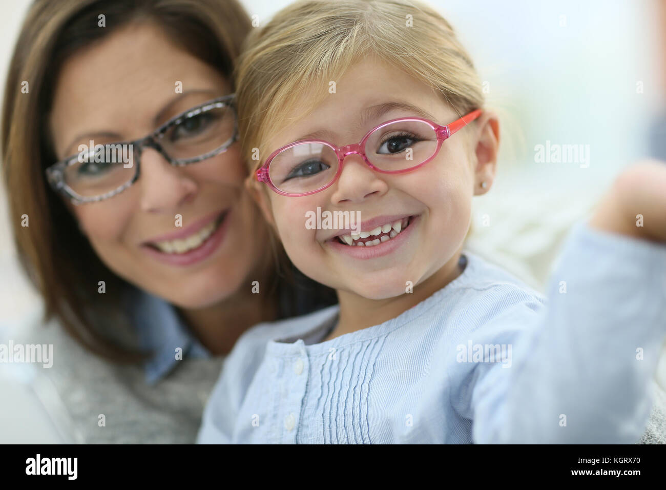 Portrait of mother and daughter wearing eyeglasses Stock Photo