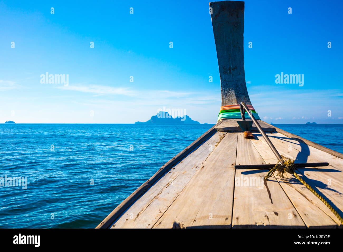 Longtail Boat In Sea At Aonang Beach Against Blue Sky Stock Photo