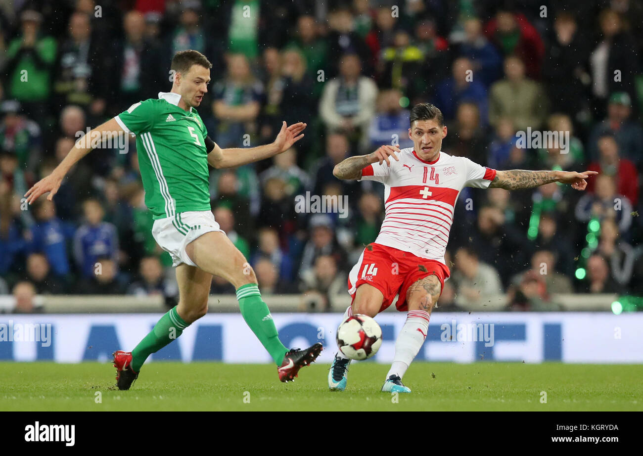 Northern Ireland's Jonny Evans (left) and Switzerland's Steven Zuber battle for the ball during the 2018 World Cup Qualifying Play-Off, First Leg match at Windsor Park, Belfast. Stock Photo