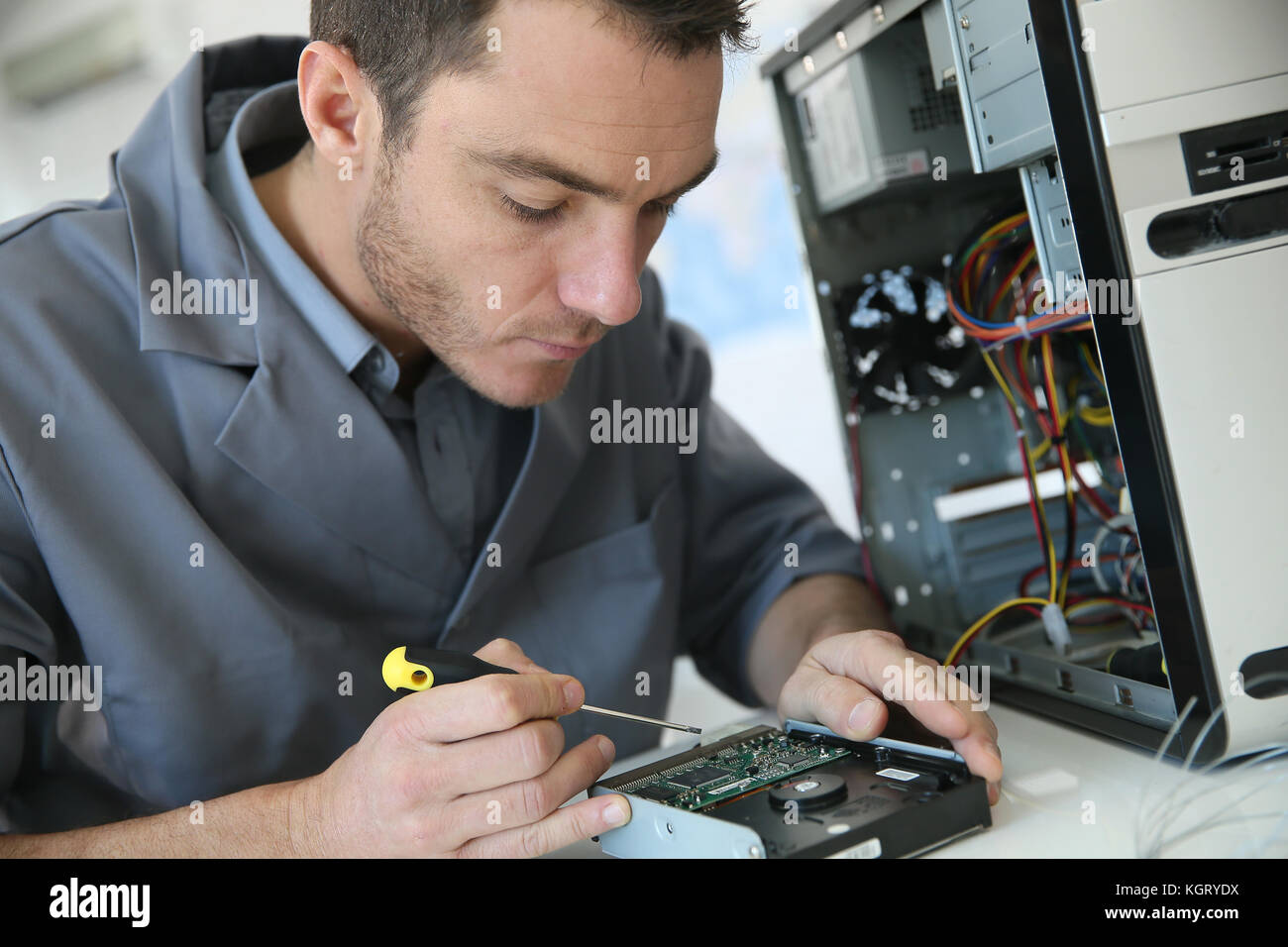 Technician fixing computer hardware Stock Photo