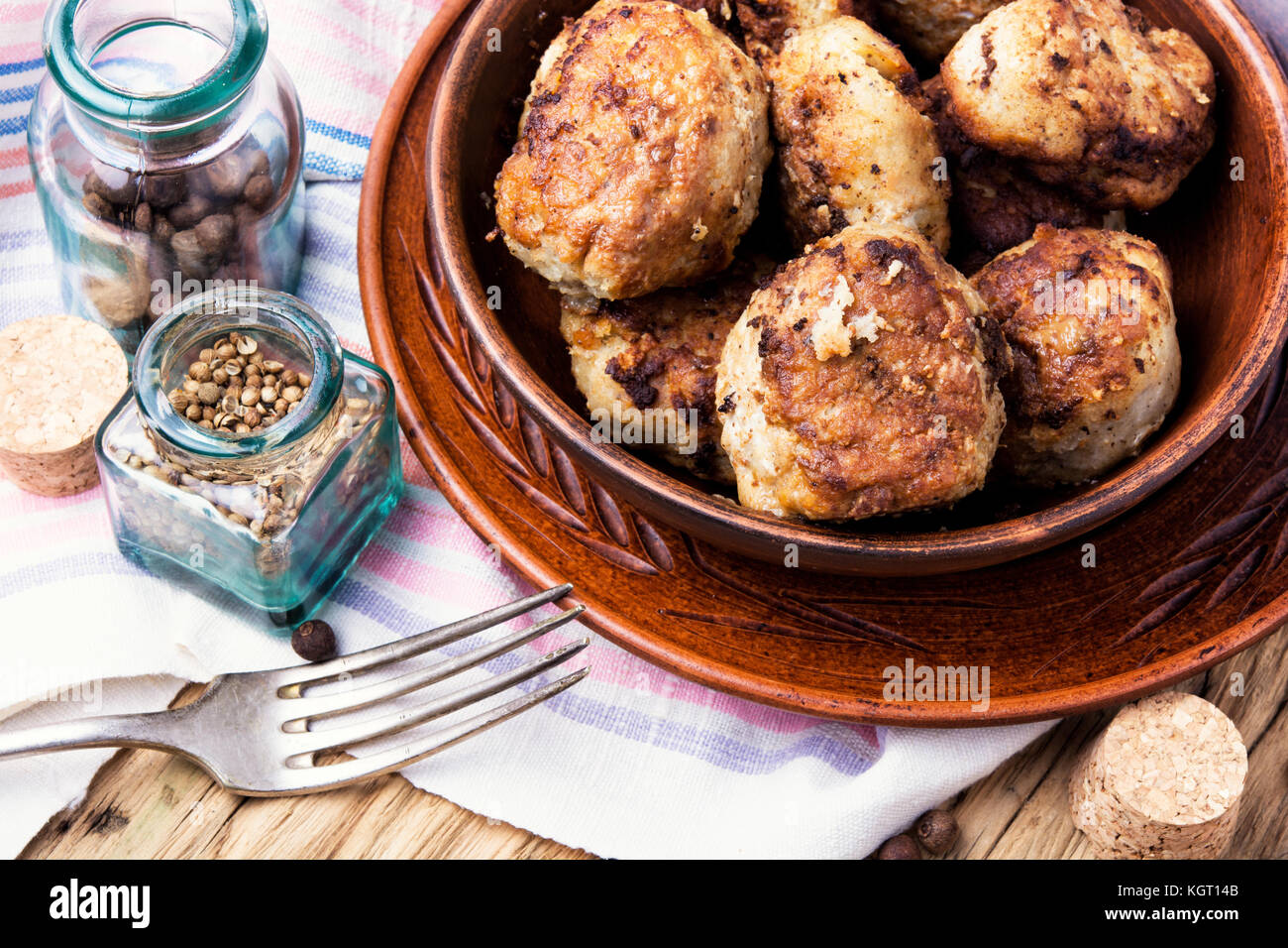 Homemade cutlets in clay ware on a plate.Ukrainian food Stock Photo