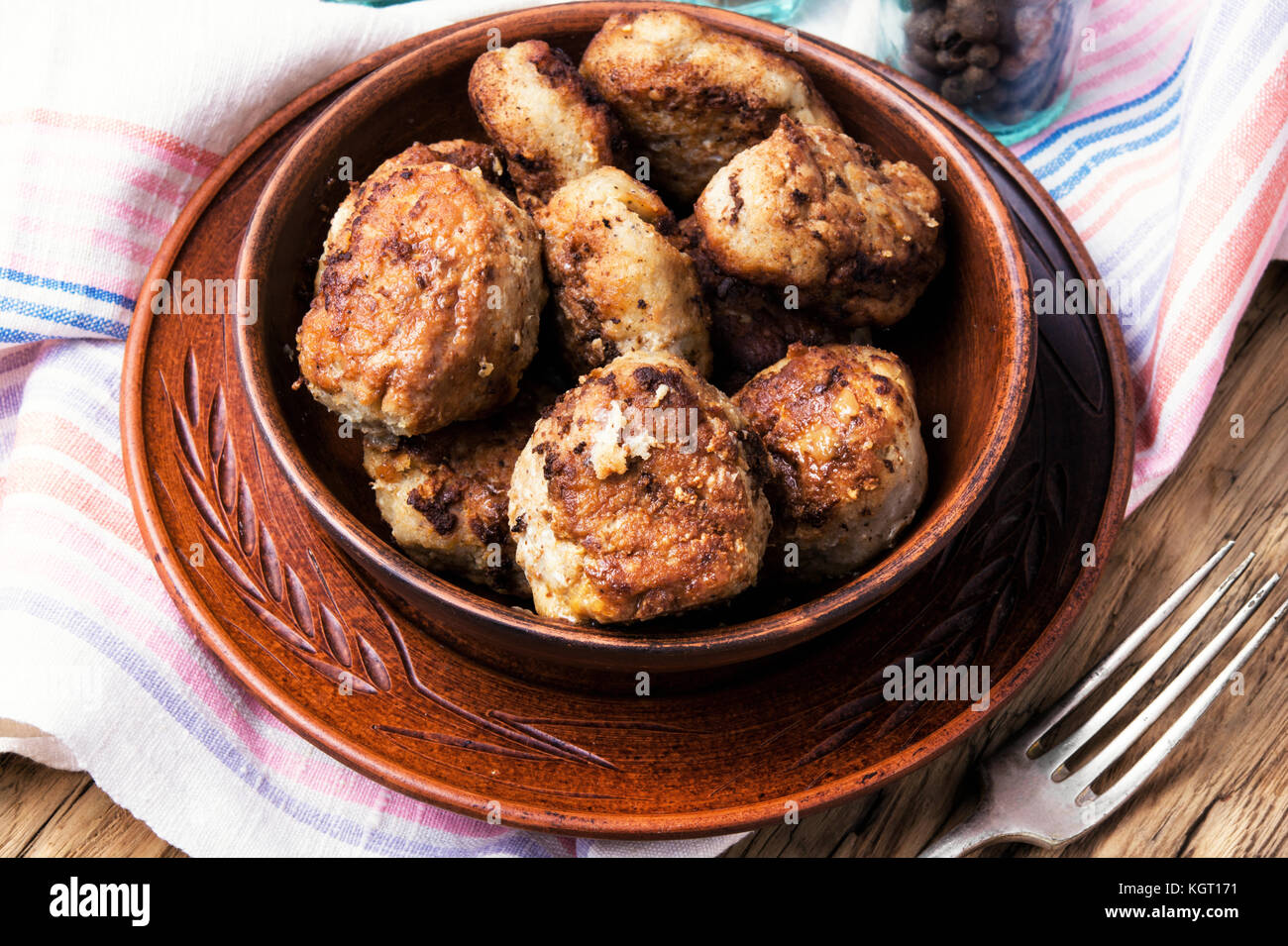 Meat cutlets in clay ware on a plate.Ukrainian food Stock Photo