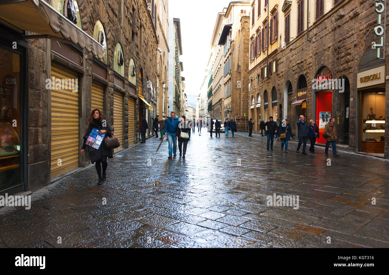 FLORENCE, ITALY - FEBRUARY 06, 2017: The old medieval street in Firenze, after the rain Stock Photo