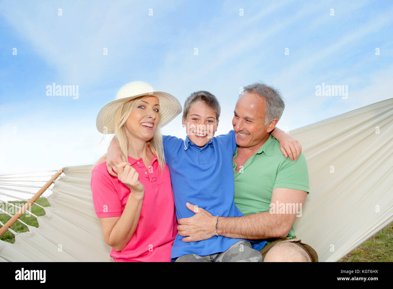 Portrait of family in a hammock Stock Photo - Alamy