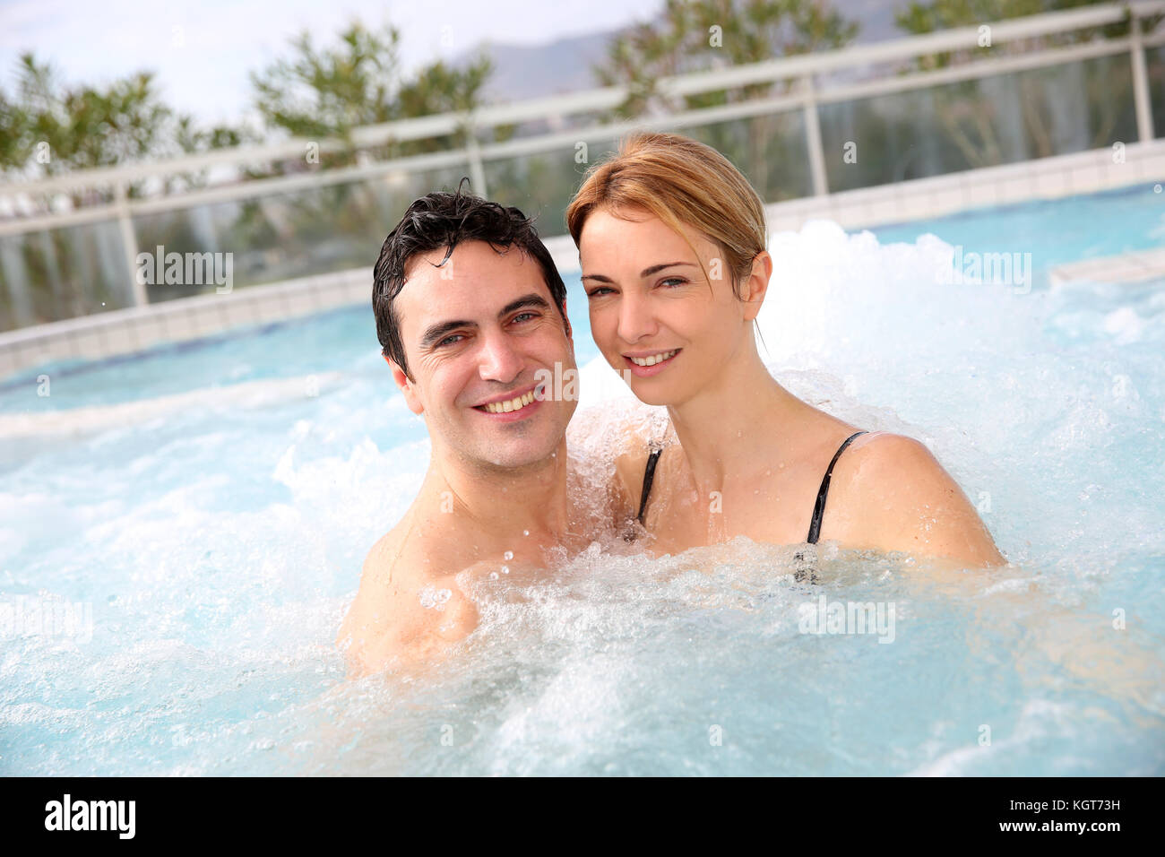 Couple enjoying jacuzzi in spa center Stock Photo Alamy