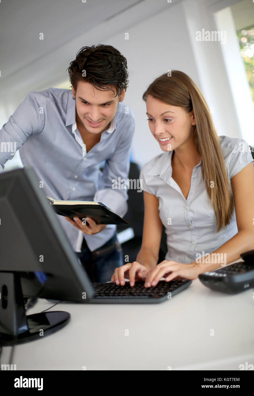 Business partners at work in front of desktop Stock Photo - Alamy