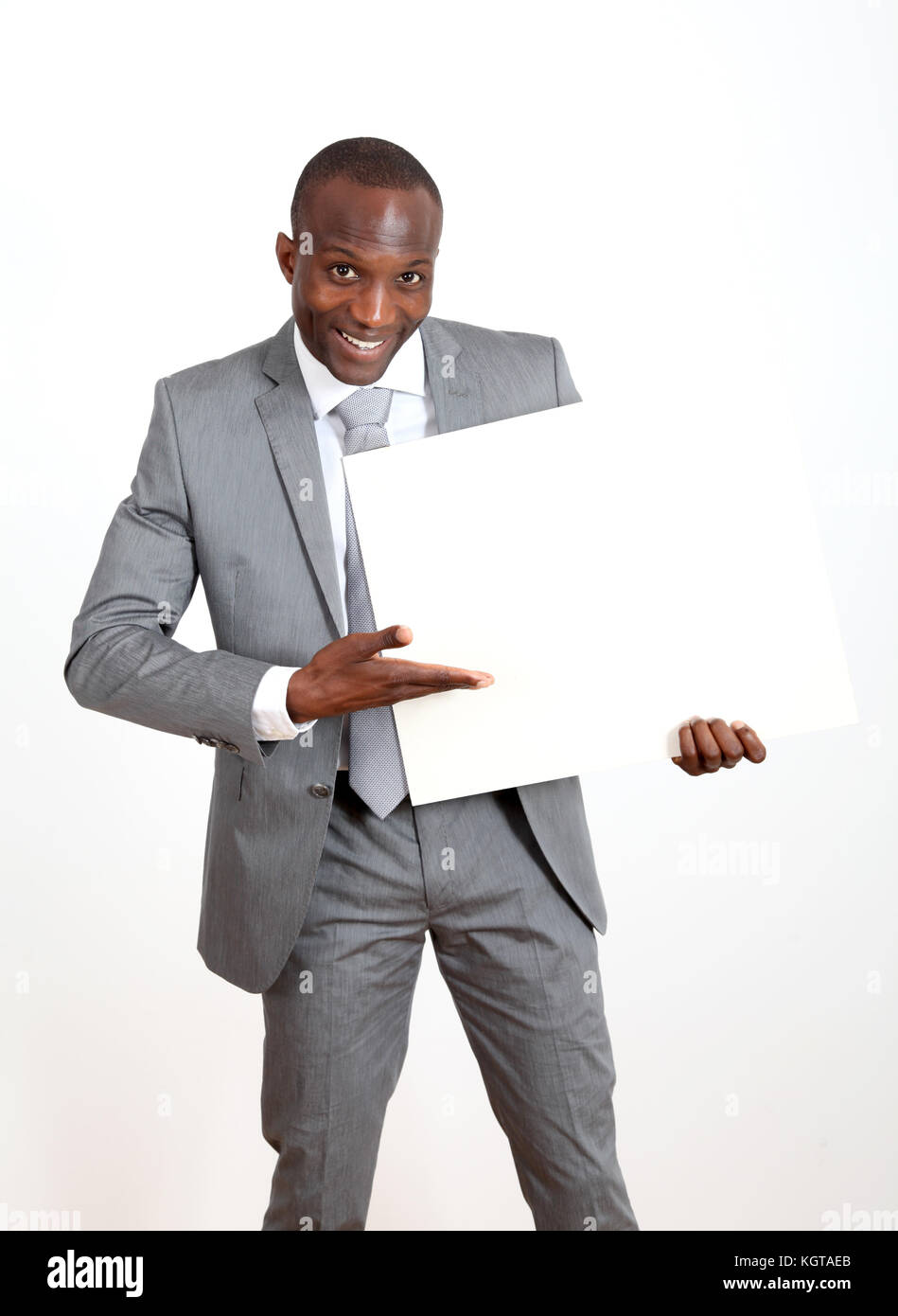 Businessman holding white message board Stock Photo Alamy