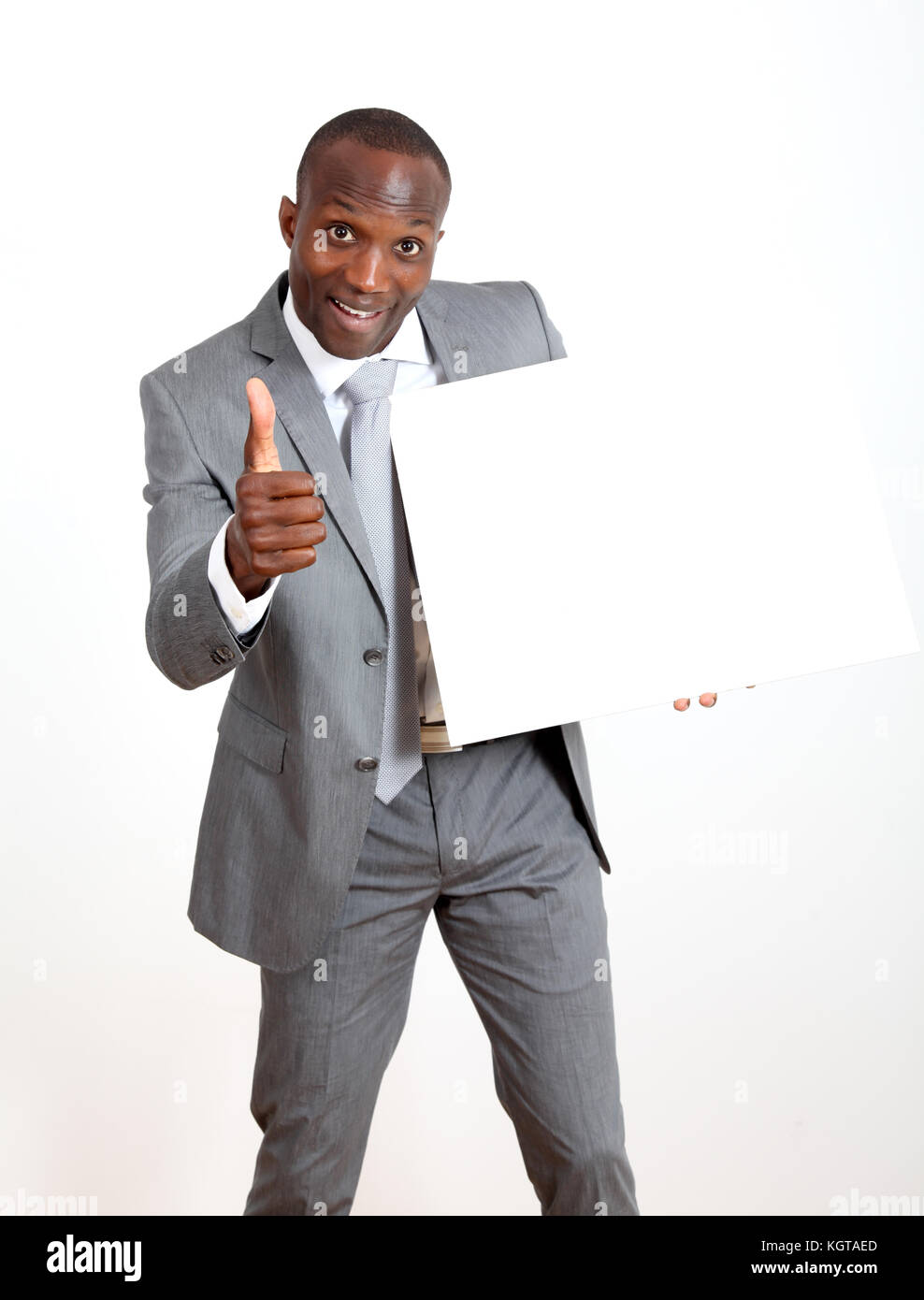 Businessman holding white message board Stock Photo Alamy