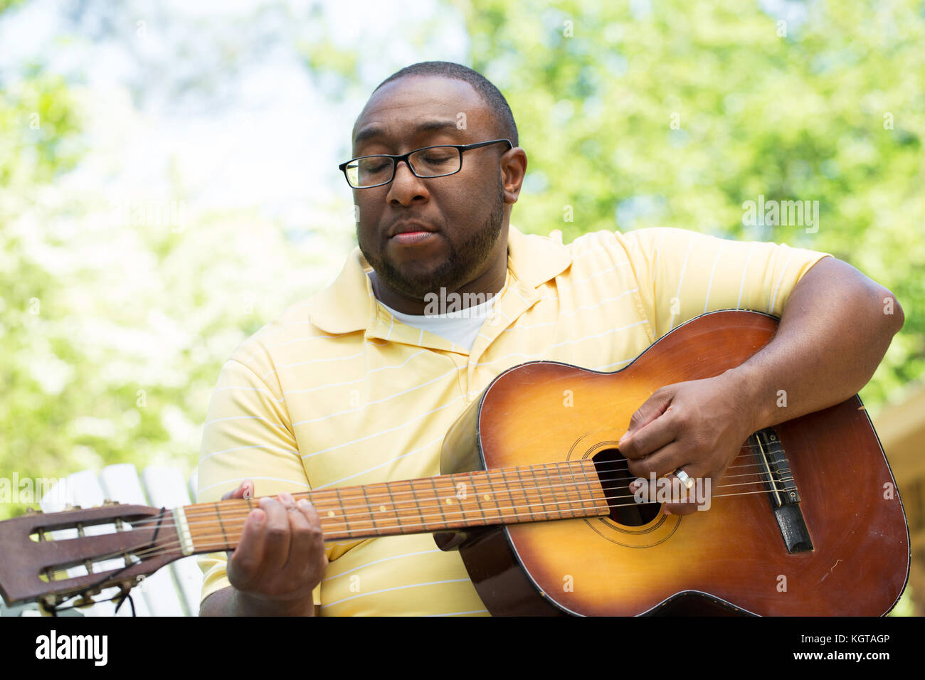 African American man playing a guitar Stock Photo - Alamy