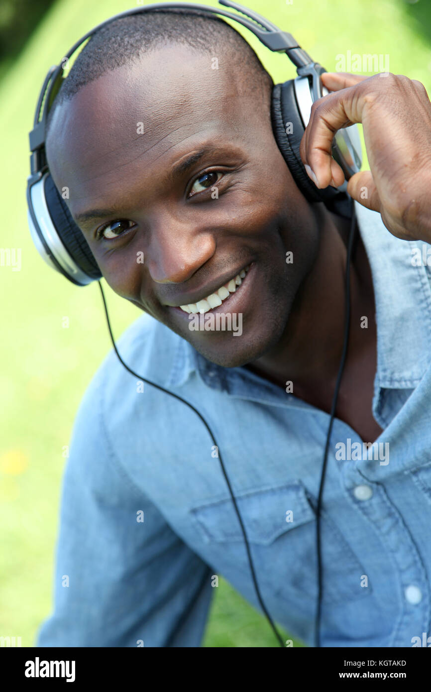 Man relaxing in park headphones hi-res stock photography and images - Alamy