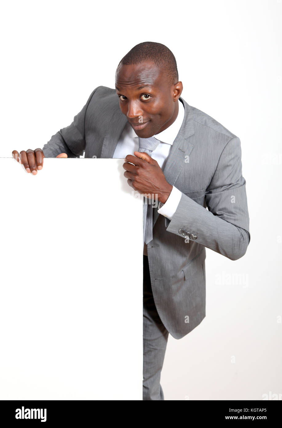 Businessman holding white message board Stock Photo Alamy