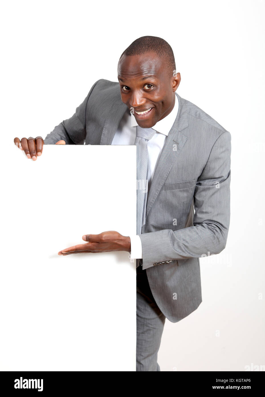 Businessman holding white message board Stock Photo Alamy