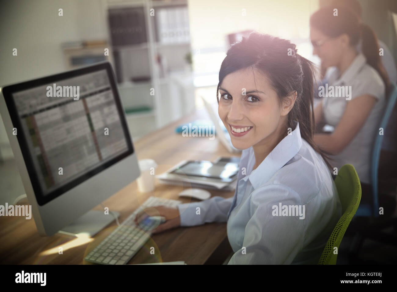 Cheerful young woman attending business training Stock Photo