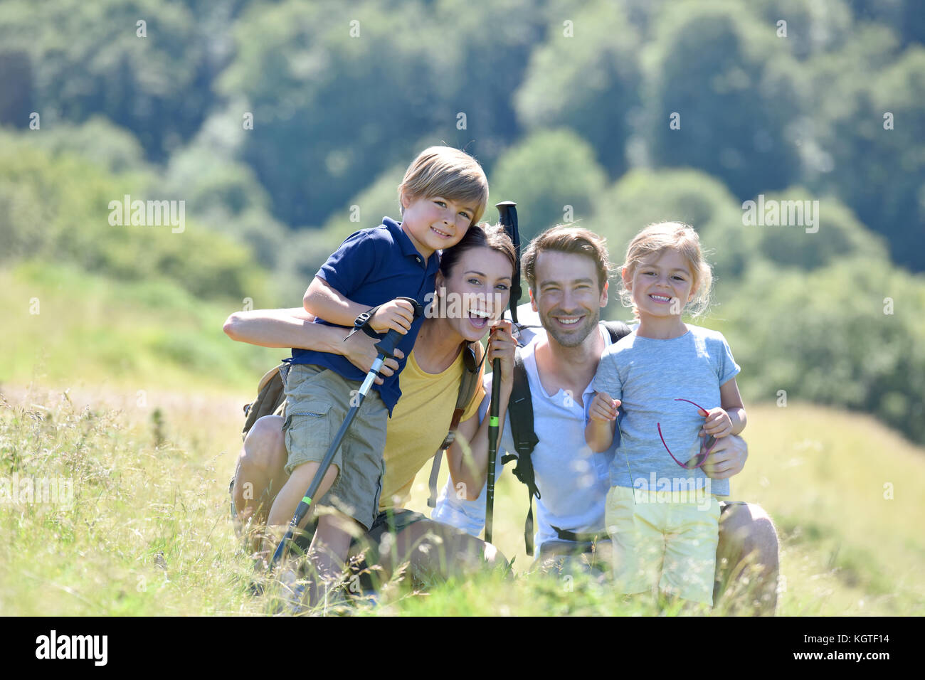Portrait of happy family on a hiking day in the mountain Stock Photo ...