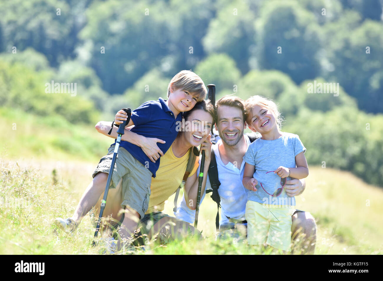 Portrait of happy family on a hiking day in the mountain Stock Photo ...
