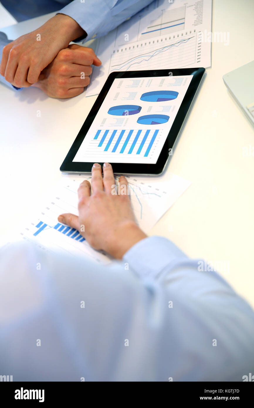 Closeup of tablet screen presenting charts Stock Photo - Alamy
