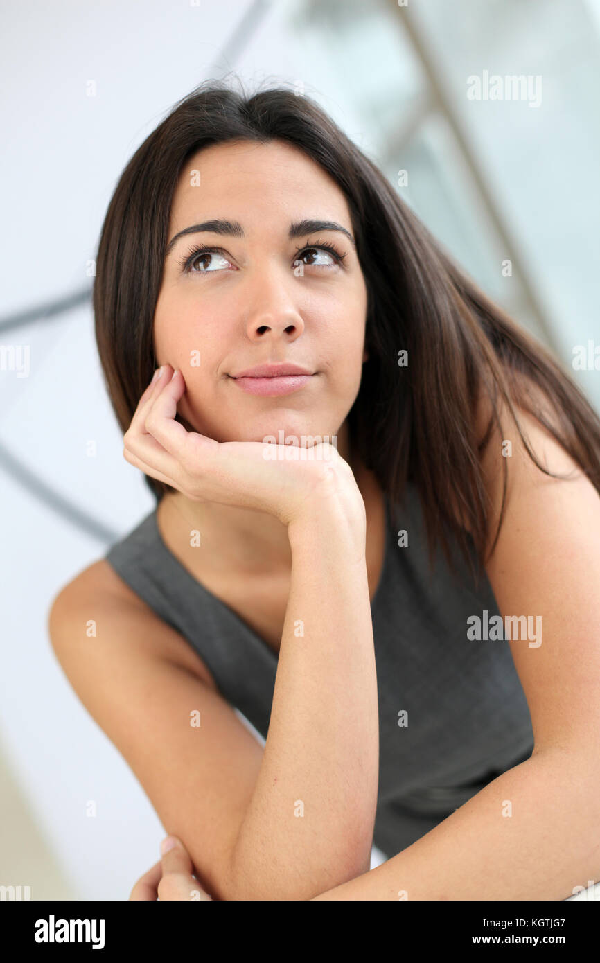 Hand on chin girl thinking hi-res stock photography and images - Alamy