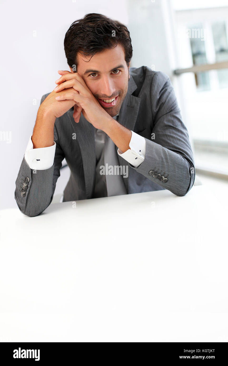 Businessman sitting a his desk for meeting Stock Photo - Alamy