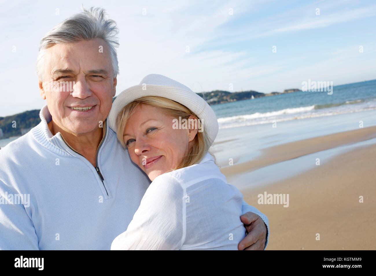 Senior couple walking on the beach in fall season Stock Photo - Alamy