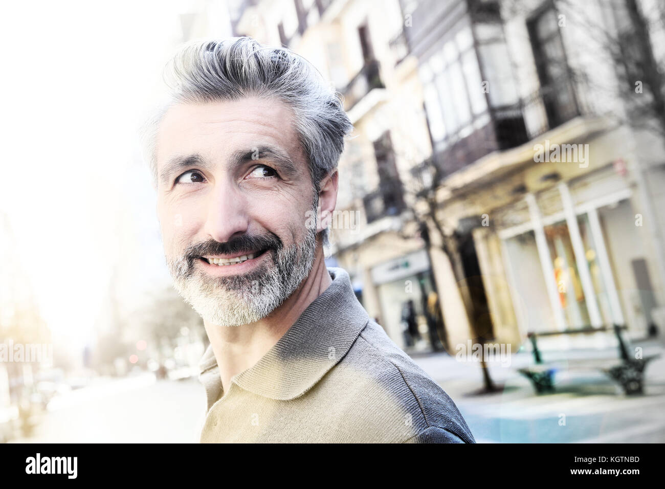 Handsome mature man standing in the street Stock Photo
