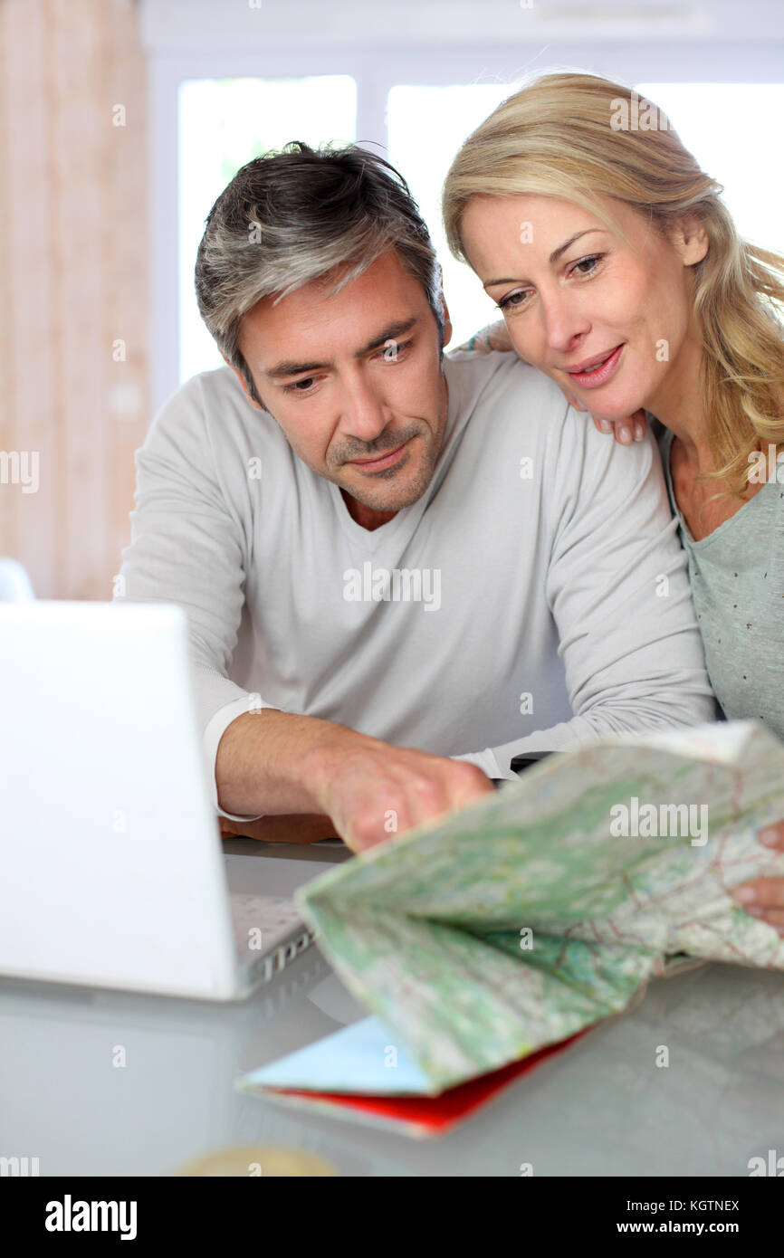 Planning vacation laptop map hi-res stock photography and images - Alamy