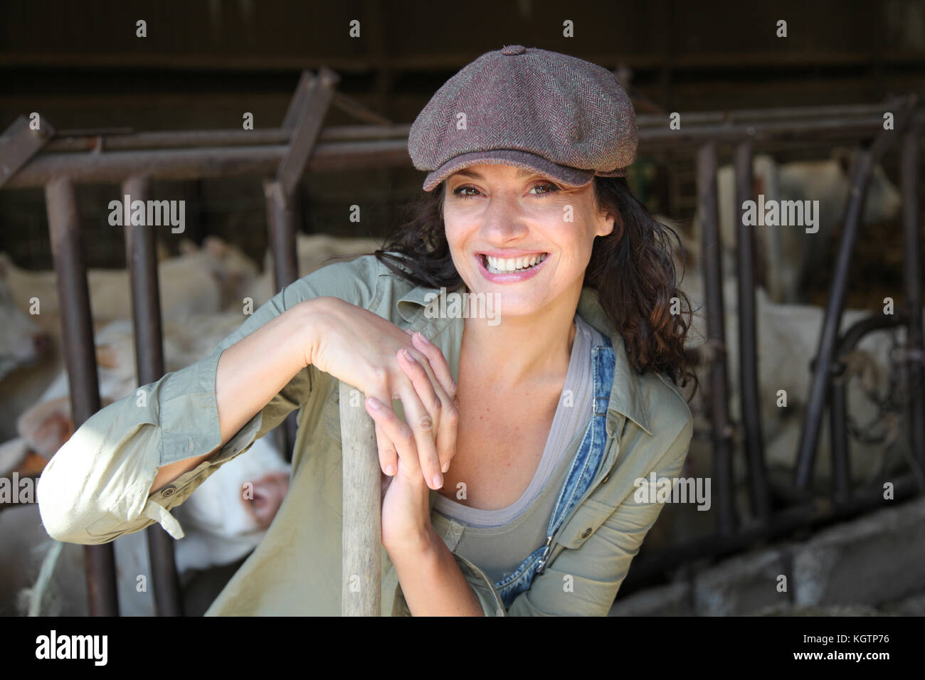 Portrait of smiling farmer in barn Stock Photo - Alamy