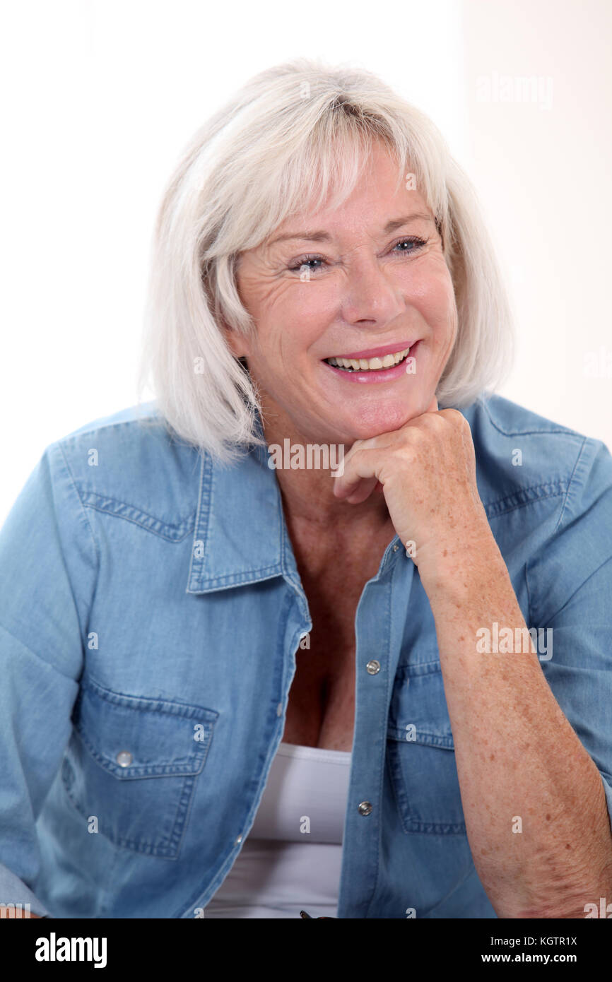 Woman in blue shirt sitting hi-res stock photography and images - Alamy