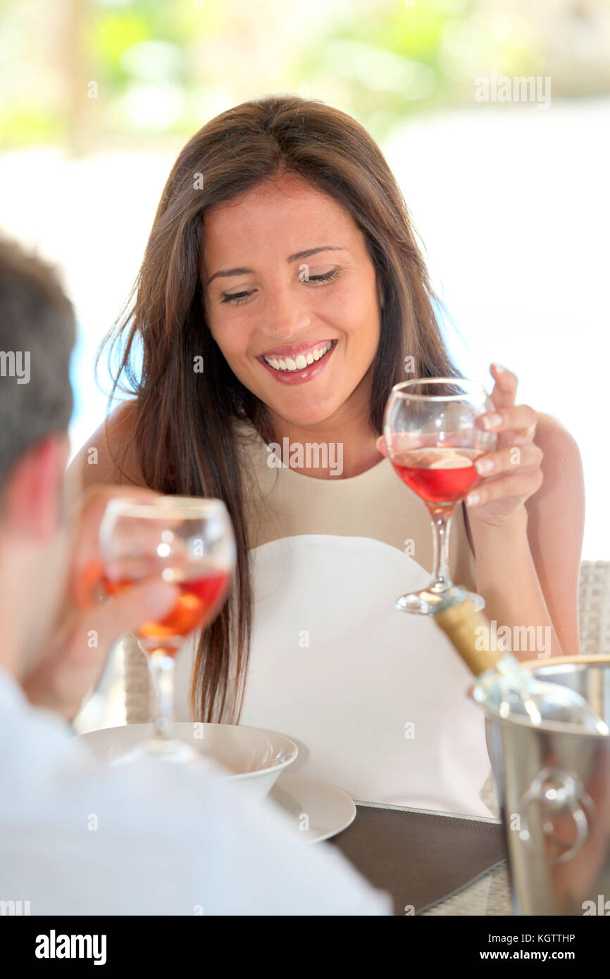 Portrait of attractive woman drinking wine in restaurant Stock Photo