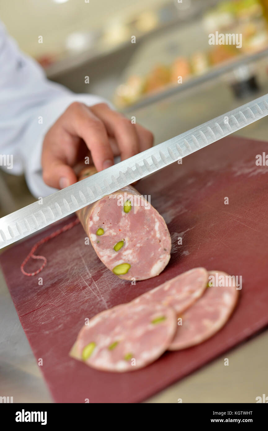 Closeup of pork sausage being cut Stock Photo Alamy