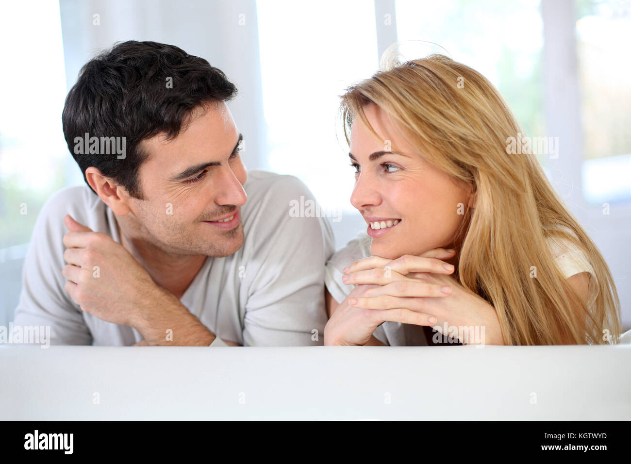 Lovers man woman sitting hugging hi-res stock photography and images ...