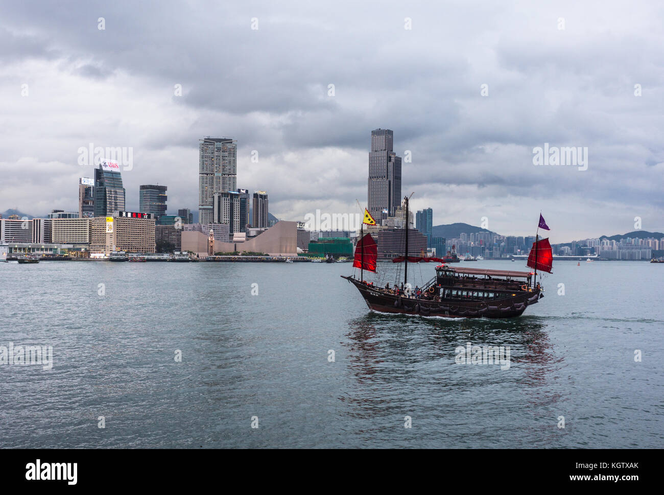 HONG KONG, CHINA - JUNE 18, 2017: A traditional Chinese Junk cruise boat transport tourist across the Victorial harbor in Hong Kong. It is sailing in  Stock Photo