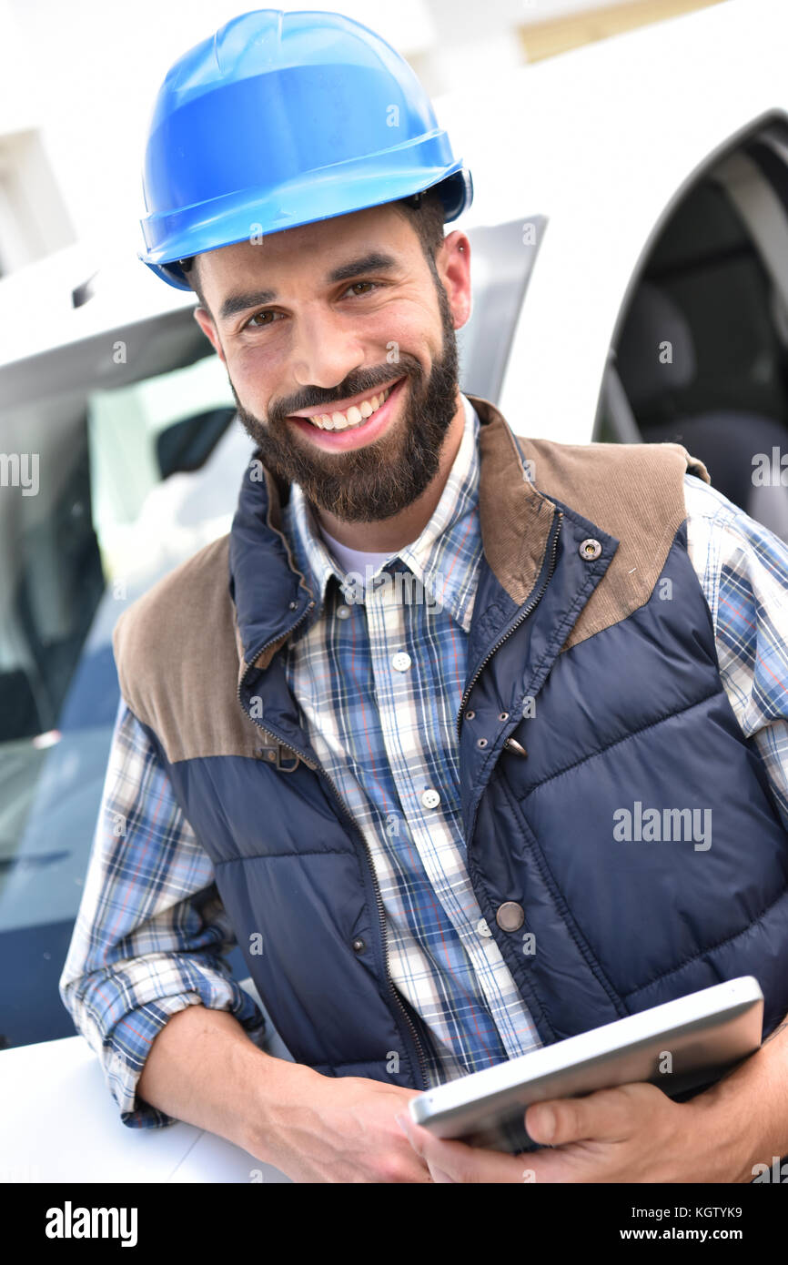 Engineer with hardhat and sunglasses driving car Stock Photo - Alamy