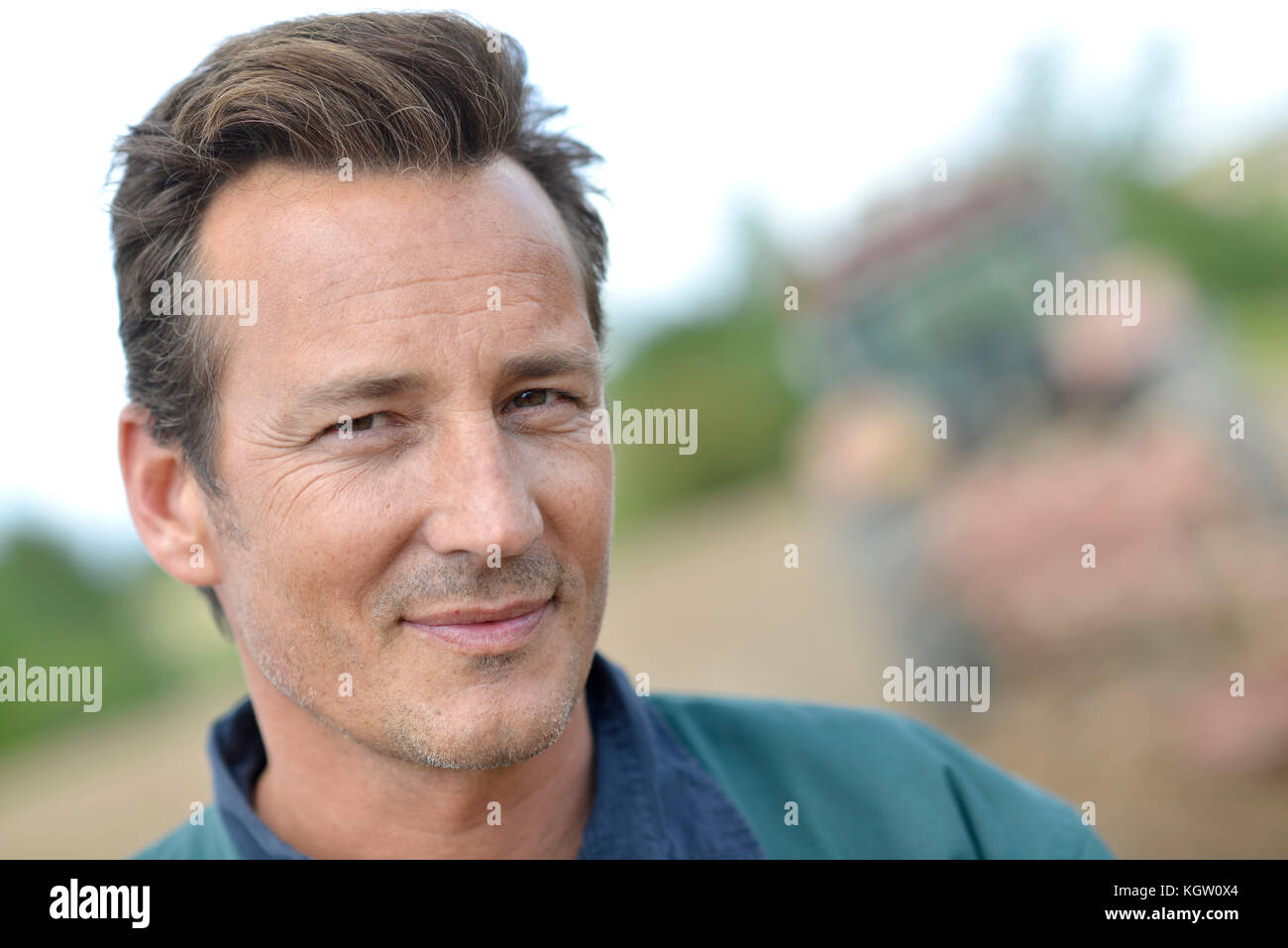 Portrait of smiling farmer in cultivated land Stock Photo - Alamy