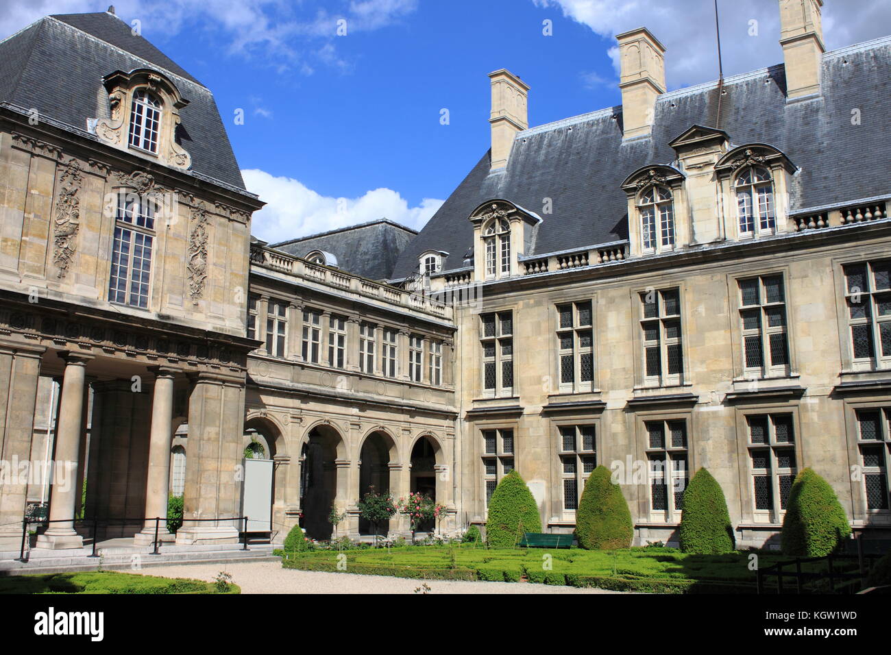 PARIS, FRANCE - MAY 24, 2015: Courtyard with the beautiful gardens of Carnavalet Museum. The museum was opened in 1880 and is dedicated to the history Stock Photo