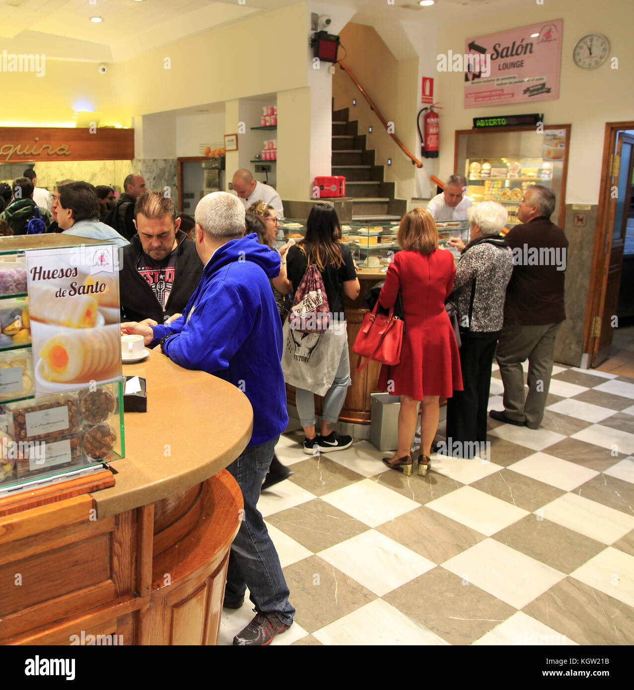 Customers inside baker confectionery shop, La Mallorquina, Calle Mayor